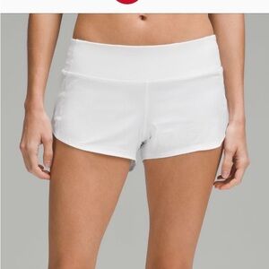 Lululemon white 2.5in speed up shorts. Size 4.  Little roughage on bottom area.